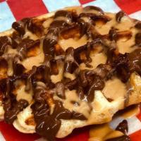 The Buckeye · Our Crown waffle topped with Nutella and Reese's peanut butter sauce.