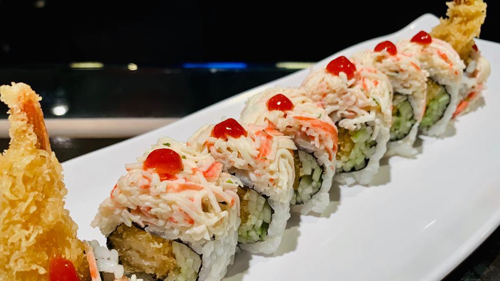 Snow · Special roll. Shrimp tempura, cucumber topped with blue crab and crabmeat.