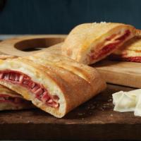 Original Meat Stromboli & Calzone · Ham, Salami & Pepperoni with Cheese. Pick Stromboli (sauce on the side) or Calzone (sauce in...