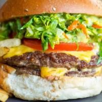 Double Cheese Burger · Two 1/4  pound beef patties make up the Double Cheese burger with lettuce, tomato, pickles ,...