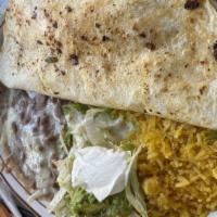 Special Quesadilla · Grilled chicken or steak, 10 inch tortilla served with lettuce, tomatoes, guacamole and sour...