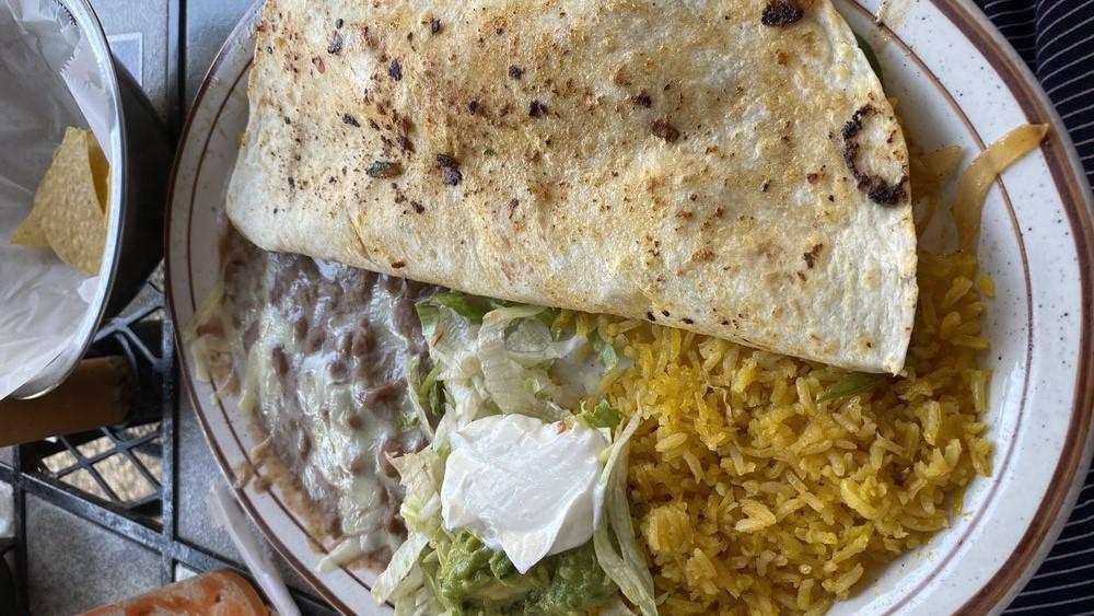 Special Quesadilla · Grilled chicken or steak, 10 inch tortilla served with lettuce, tomatoes, guacamole and sour cream.