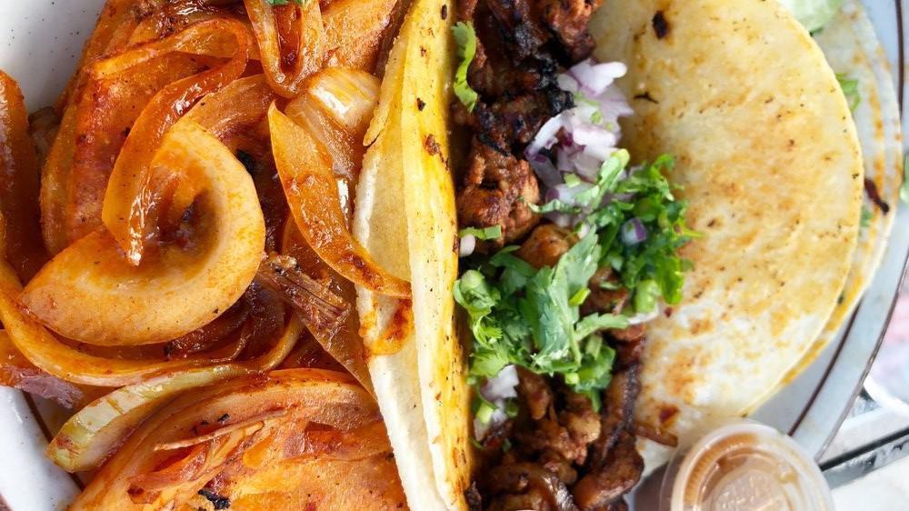 Barbacoa · Marinated tortilla with grilled onions.