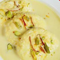 Rasmalai · Dessert Made from Cheese, Milk, and Almonds Seasoned with Pisatchio Nuts.
