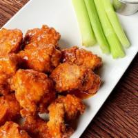 Boneless Wings Appetizer · hand-breaded, buttermilk-fried boneless wings tossed with one of our signature sauces.