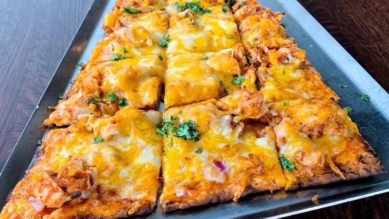 Bbq Chicken Flatbread Appetizer · BBQ-tossed chicken, red onion, cheddar and jack cheeses and fresh cilantro on a BBQ sauce-brushed lavosh.