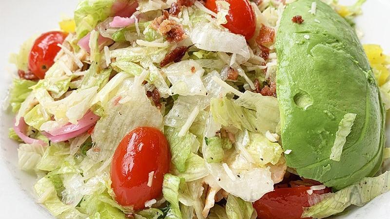 Italian Chop Salad · grilled chicken, banana peppers, grape tomatoes, green onions, chopped bacon, shredded parmesan and sliced avocados tossed in red wine vinegar dressing.