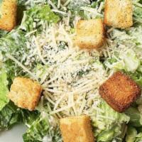 Petite Caesar Salad · crisp romaine lettuce, shredded parmesan cheese and crunchy garlic croutons tossed in our ho...