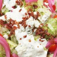 Bleu Cheese Chop · shredded iceberg lettuce drizzled with our famous bleu cheese dressing, plus pickled red oni...
