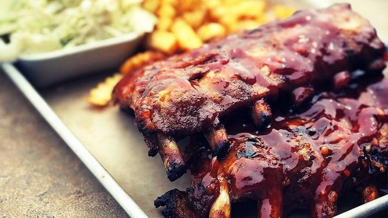 Baby Back Ribs · our house-rubbed, fall-off-the-bone back ribs, braised in duke pale ale for hours and char-grilled with house-made bbq sauce. served with french fries and house-made coleslaw.