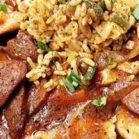 Cajun Jambalaya · cajun rice with andouille sausage, chicken, shrimp, bell pepper, celery and onion in a spicy...