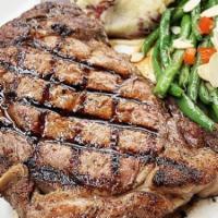 Ribeye · 14 oz. USDA Choice boneless ribeye steak, served with redskin mashed potatoes and green bean...