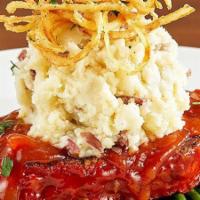 Granite City Meatloaf · hand-made meatloaf layered with garlic mashed potatoes and topped with crispy onion strings,...