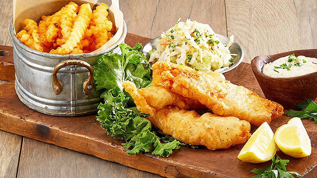 Fish And Chips · northern lager-battered fish, served with malt vinegar fries, creamy coleslaw and house-made tartar sauce.