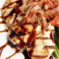 Mediterranean Chicken · flavorful grilled chicken breasts over rice pilaf and asparagus, served with roma tomatoes, ...