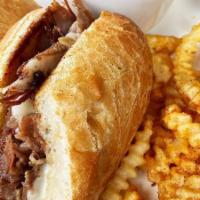 Roasted Prime Rib Sandwich · slow-roasted prime rib sliced thin with provolone cheese on a fresh-grilled baguette with au...