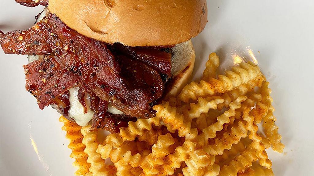 Millionaire'S Bacon Burger · Half-pound GC signature beef blend, piled high with melted white cheddar cheese and a stack of spiced millionaire’s bacon, served with our house-made lemon aioli on a brioche bun.