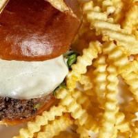 Gastro Pub Bison Burger · North Dakota bison topped with provolone cheese, roasted garlic aioli, and arugula on a pret...