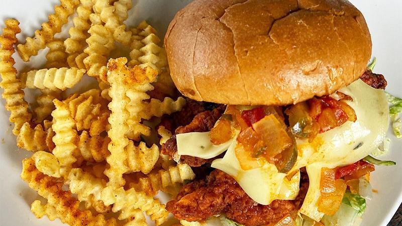 Spicy Chicken Sandwich · crispy buttermilk-fried chicken tossed in buffalo sauce and topped with pepper-jack cheese. served.