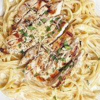Chicken Alfredo · creamy house-made alfredo sauce tossed with linguine noodles and topped with grilled chicken...