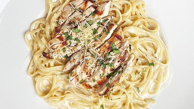 Chicken Alfredo · creamy house-made alfredo sauce tossed with linguine noodles and topped with grilled chicken breast.