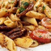 Cajun Pasta · sautéed andouille sausage and tender chicken, red onion, bell pepper and grape tomato, simme...