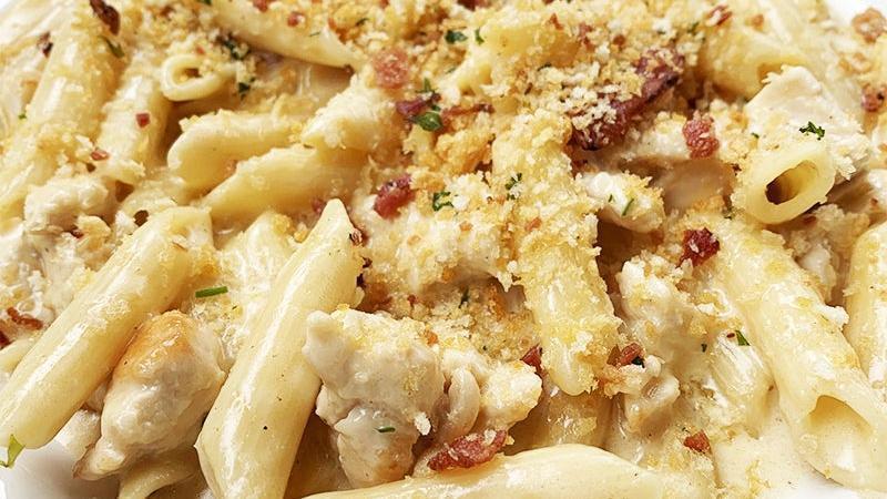 Bock & Cheese Pasta · chicken and penne pasta tossed in our creamy, bock-infused pepper jack cheese sauce, then topped with bacon and breadcrumbs.