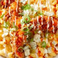 Buffalo Mac & Cheese · macaroni and cheese tossed with buffalo sauce, topped with buttermilk-fried chicken strips a...