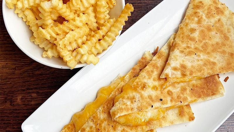 Kids' Quesadilla · A blend of cheeses, melted inside of a crispy flour tortilla.