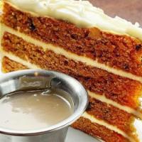 Carrot Cake · Layers of carrot cake and cream cheese icing with salted caramel sauce.