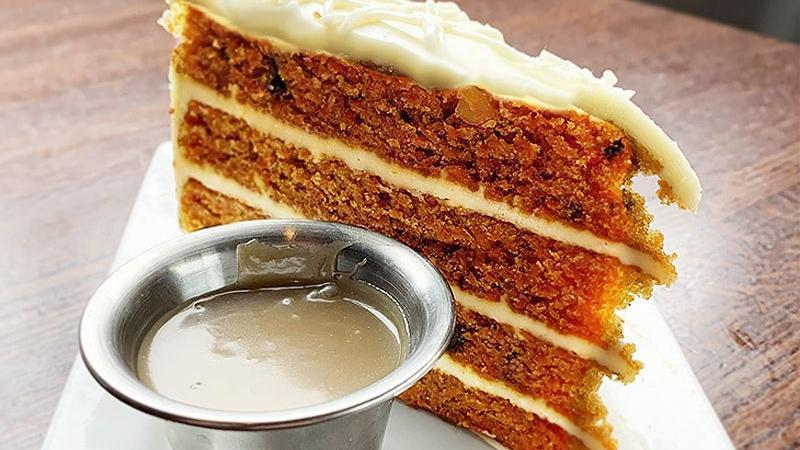 Carrot Cake · Layers of carrot cake and cream cheese icing with salted caramel sauce.