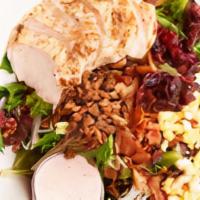 Applewood Chicken Salad · Applewood smoked bacon and thick slices of grilled chicken top this salad of mixed greens wi...