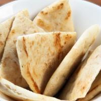 Warm Pita Bread · Vegetarian, vegan. A warm side of pita bread to enjoy alongside your hummus, your salad, or ...