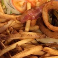 El Coyote Burger · Glazed with our habanero mango sauce and topped with pepper jack, onion rings, and jalapenos.