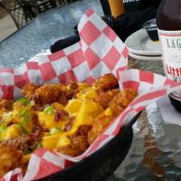 Loaded Tator Tots · Gluten free. Melted cheddar Cheese sauce, bacon, and green onions. Served with sour cream on...