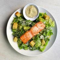 Salmon Caesar Salad · Chargrilled fresh salmon, Reggiano parmesan, homemade croutons and Caesar dressing. All Cars...