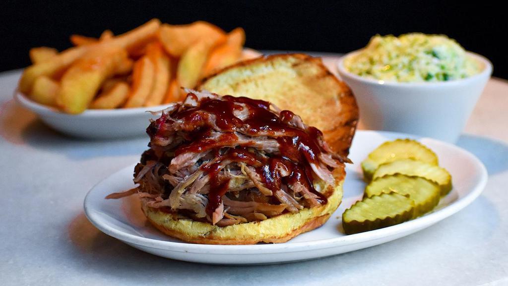 Bbq Pork Sandwich · 24 Hr Slow Smoked on the bone overnight Barbecue Pork shoulder served daily until we run out. Sandwich includes award winning Cole Slaw and choice of potato or fresh green vegetable.