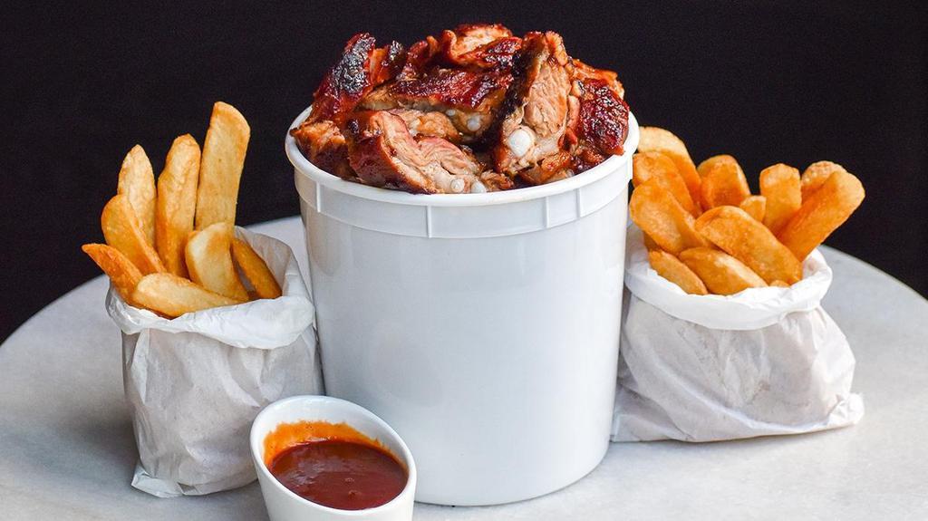 Bbq Rib Tips Bucket · Slow Smoke Barbecued char and chopped, spare rib ends. Rib Tip Bucket includes 2 potato choice and extra Carson's Signature BBQ Sauce (serves 2-3)