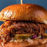 Bbq Pork Sandwich · ★ For in-house prices, order direct on Hangry.io ★
Smoked pork shoulder with BBQ sauce, pick...
