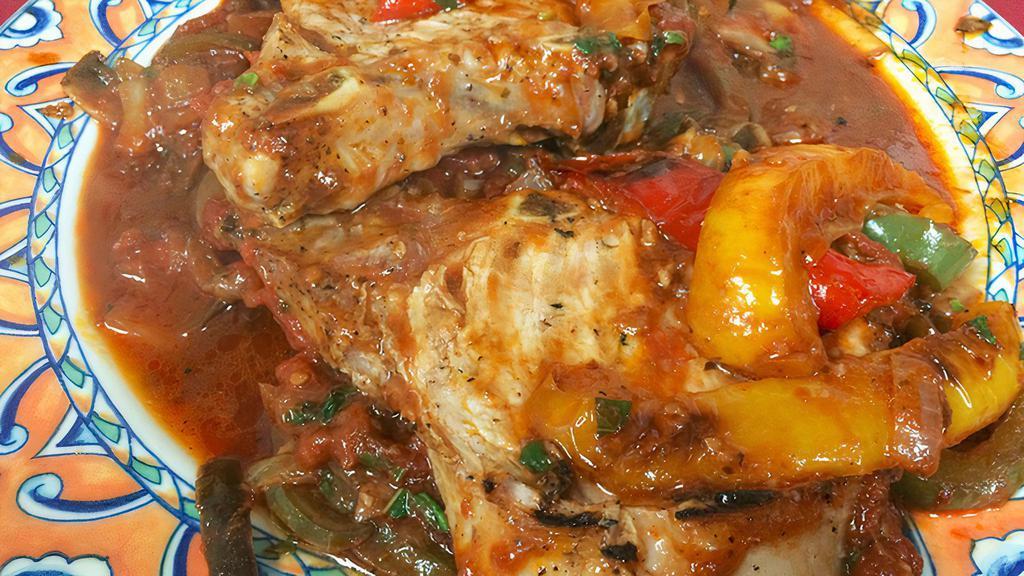 Pork Chops Italiano · Two center cut pork chops, sautéed with green peppers, mushrooms, onions, and red plum tomatoes.
