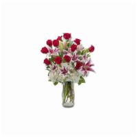 Inspired · A classically gorgeous arrangement of a dozen red roses, accented with Lilies and Hydrangea ...