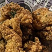 Alligator Bites · Straight from the bayou with swamp sauce.