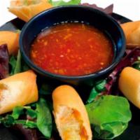 Egg Roll · Vegetable egg roll with sweet chili sauce.
