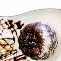 Homemade Choco Choco Lava Cake · Dark chocolate lava cake with fresh whipped cream.