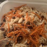  Kabuli Pulao · Basmati rice, lamb shanks, topped with raisins, almonds, and carrots.