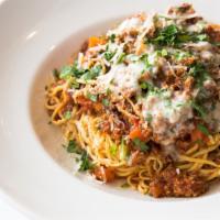 Spaghetti Bolognese · Slow-cooked meat sauce, herb butter, parmesan.