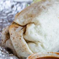 Burrito · A large flour tortilla stuffed with your choice of meat, rice, refried beans, lettuce, chees...