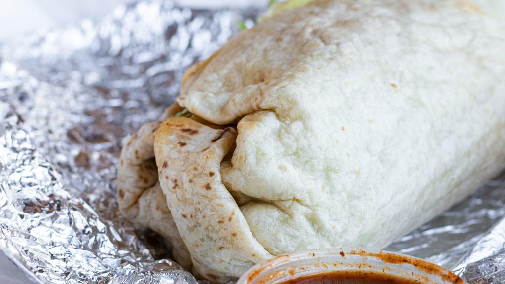 Burrito · A large flour tortilla stuffed with your choice of meat, rice, refried beans, lettuce, cheese, onions, cilantro, pico de gallo, sour cream and hot, mild & guacamole salsas.
