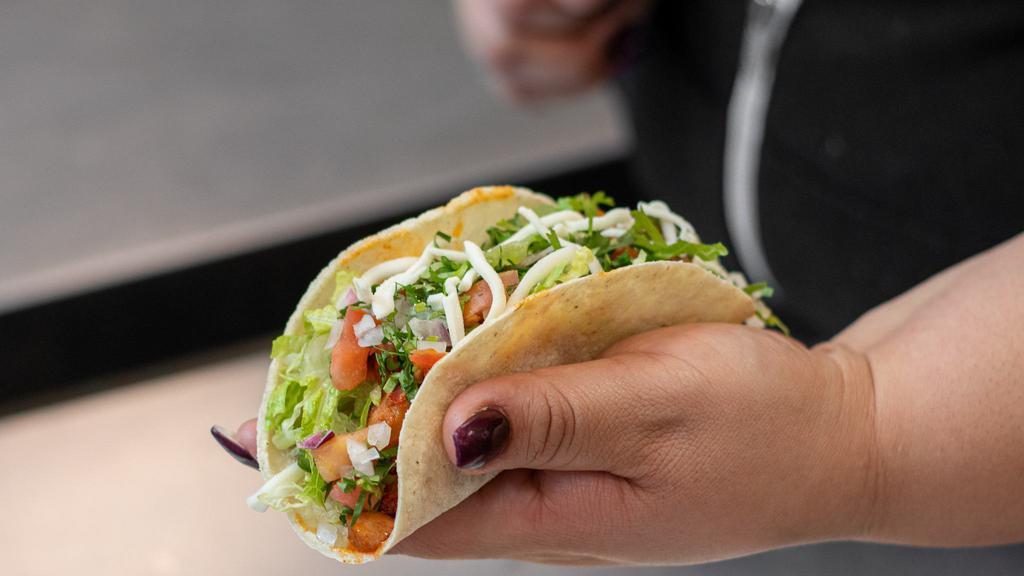 Single Dos Hermanos Taco · Soft corn tortilla filled with your choice of meat then topped with lettuce, cheese, pico de gallo, onions and cilantro. Served with your choice of salsa.