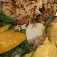 Harbor Crab Cake · Two poached eggs top a homemade crab cake and hollandaise sauce.